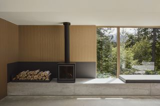 Camera House by Leckie Studio showing fireplace