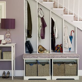 white stairs storage with baskets