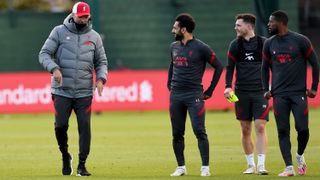 Liverpool FC manager Jurgen Klopp talks with Mohamed Salah during a recent training session at Melwood Training Ground.