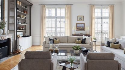 living room with neutral sofas and with French windows