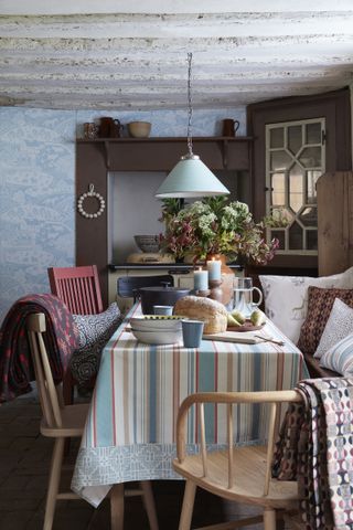 farmhouse dining table with striped cloth