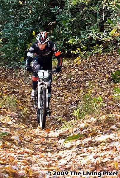 Sam Koerber (Team Gary Fisher 29er) climbs Cove Creek Trail.