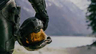 A "Halo" TV show still showing the helmet of Master Chief (Pablo Schreiber) held by his waist