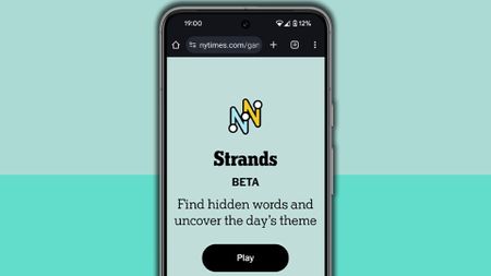 NYT Strands homescreen on a mobile phone screen, on a light blue background