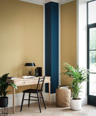 Home office with yellow and indigo contrast walls