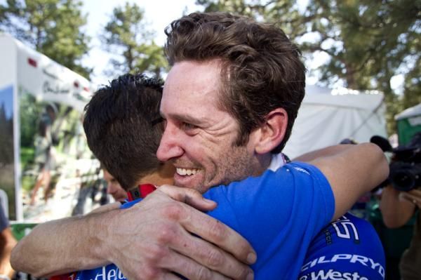 Rory Sutherland (UnitedHealthcare) is congratulated by team manager Mike Tamayo after the Australian's victory on Flagstaff Mountain.