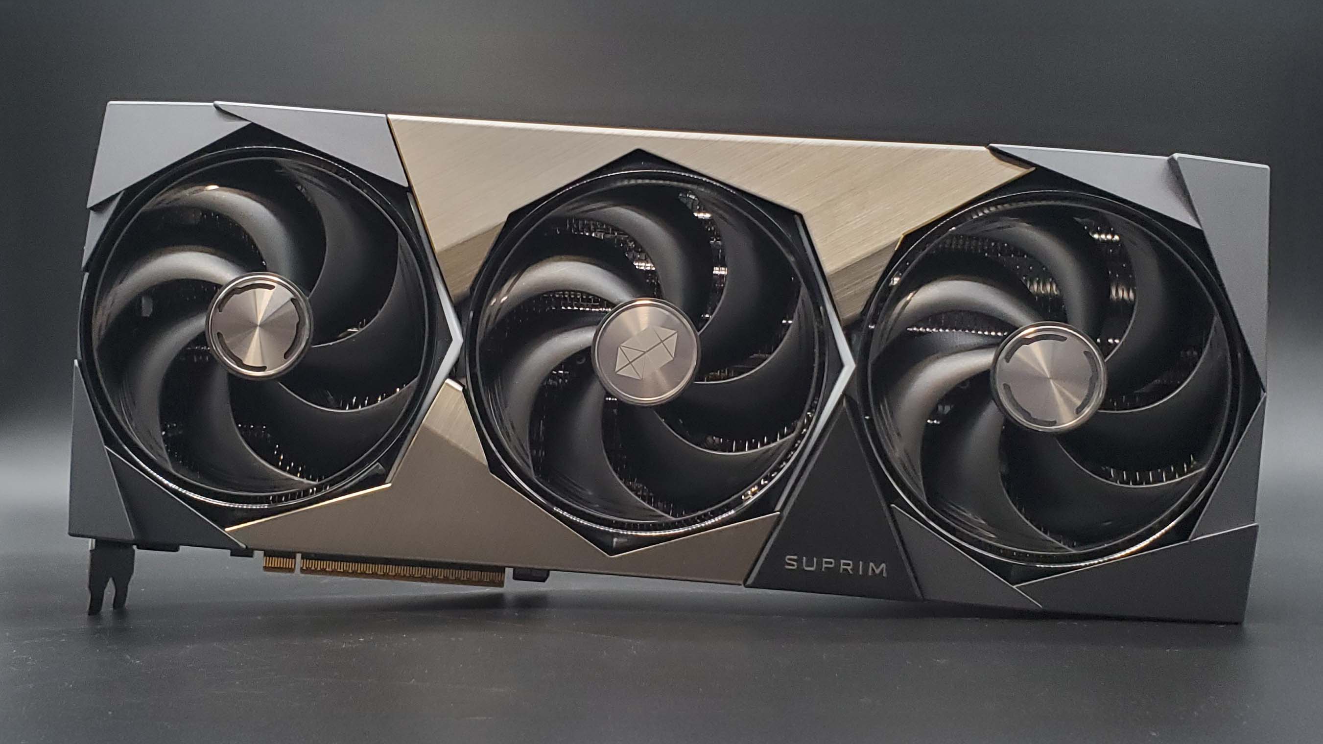 MSI RTX 5090 Suprim SOC graphics card on a grey background with a gradient