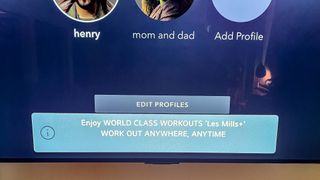 A notification about a workout app appears on the LG C2 OLED TV
