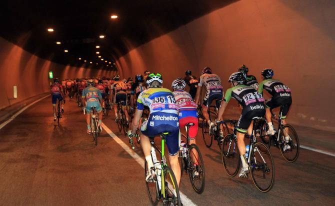 The Tour of Poland peloton in a tunnel on the opening stage in the Trentino region of Italy.