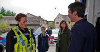 Cain Dingle's alarmed when the police arrive with news his car is at the bottom of a lake. He thinks Charity's just acting up but the others fear the worst in Emmerdale.