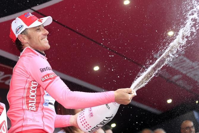 Maglia rosa wearer Luca Paolini (Katusha) celebrates another day in the Giro lead
