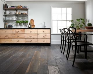 Woodpecker flooring in a kirche Berkeley cellar oak engineered wood flooring in a kitchen with open shelving, wood cabinetry and dining table