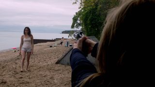 Maika Monroe aiming gun at entity in It Follows
