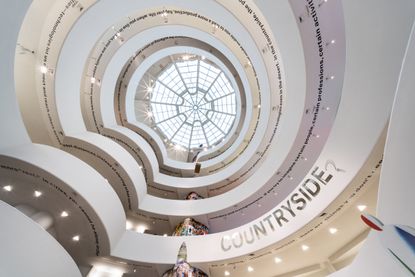 View looking up from the bottom of a spiral staircase