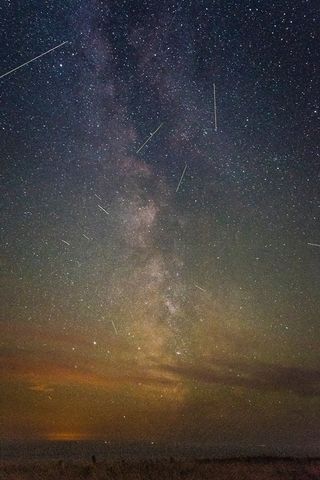 Stunning 2016 Perseid meteor shower long-exposure over Isle of Wight by Adrian Brown.