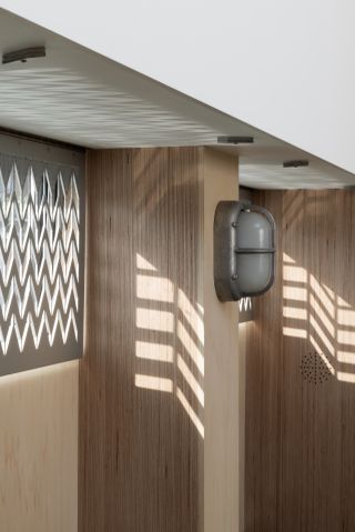 wall panels and shining light into the room