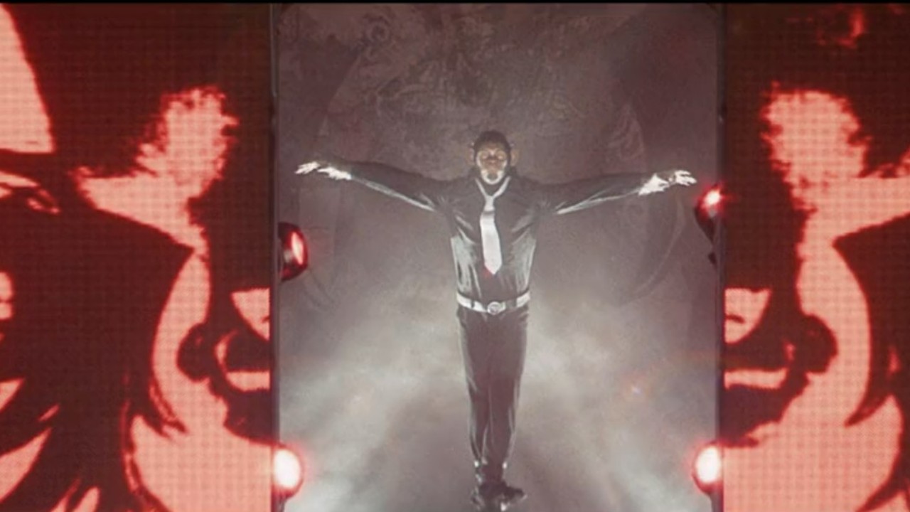Robbie Williams on stage as a monkey in Better Man.