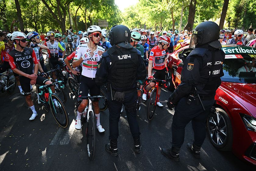 MADRID, SPAIN - SEPTEMBER 14: A general view of Ivo Oliveira of Portugal and UAE Team Emirates - XRG, Jonas Vingegaard of Denmark and Team Visma | Lease a Bike - Red Leader Jersey and the peloton is at a standstill due to the pro-Palestinian protests in the city of Madrid during the La Vuelta - 80th Tour of Spain 2025, Stage 21 a 108km stage from Alalpardo to Madrid / #UCIWT / on September 14, 2025 in Madrid, Spain. (Photo by Dario Belingheri/Getty Images)