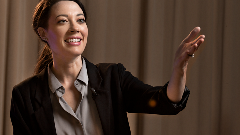 A woman using the new Shure UniPlex lavalier microphone.