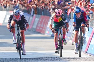 Breakaway trio Brandon McNulty, Ben Healy, and Marco Frigo race to the line on stage 15 of the Giro d'Italia in Bergamo