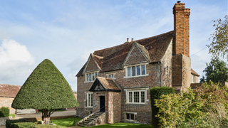 Grade II house and gardens in East Sussex.