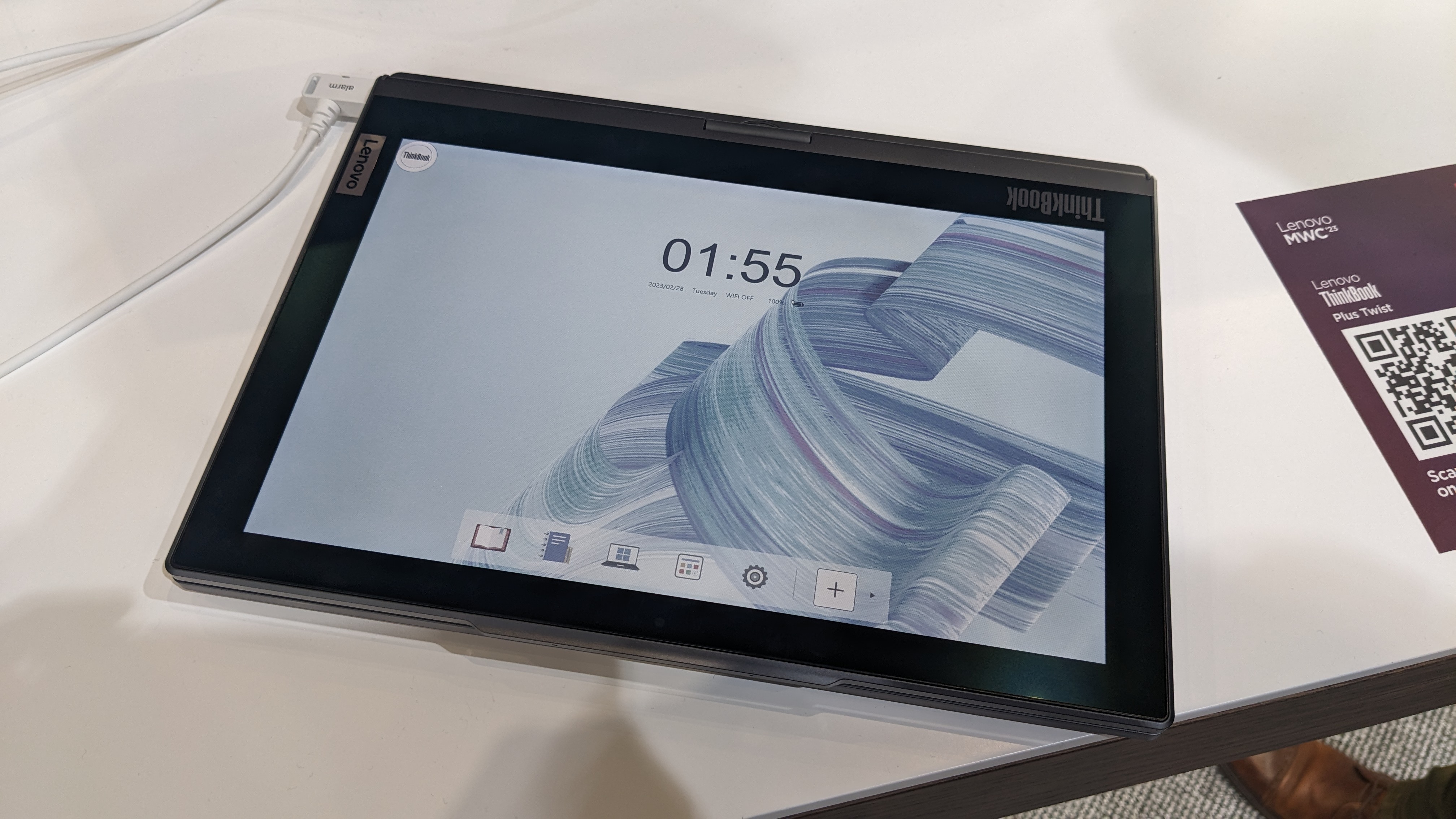 The Lenovo ThinkBook Plus Twist laptop on a display stand at the MWC 2023 event.