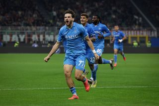 MILAN, ITALY - OCTOBER 29: Khvicha Kvaratskhelia of SSC Napoli celebrates with teammates after scoring to give the side a 2-0 lead during the Serie A match between AC Milan and SSC Napoli at Stadio Giuseppe Meazza on October 29, 2024 in Milan, Italy. (Photo by Jonathan Moscrop/Getty Images)