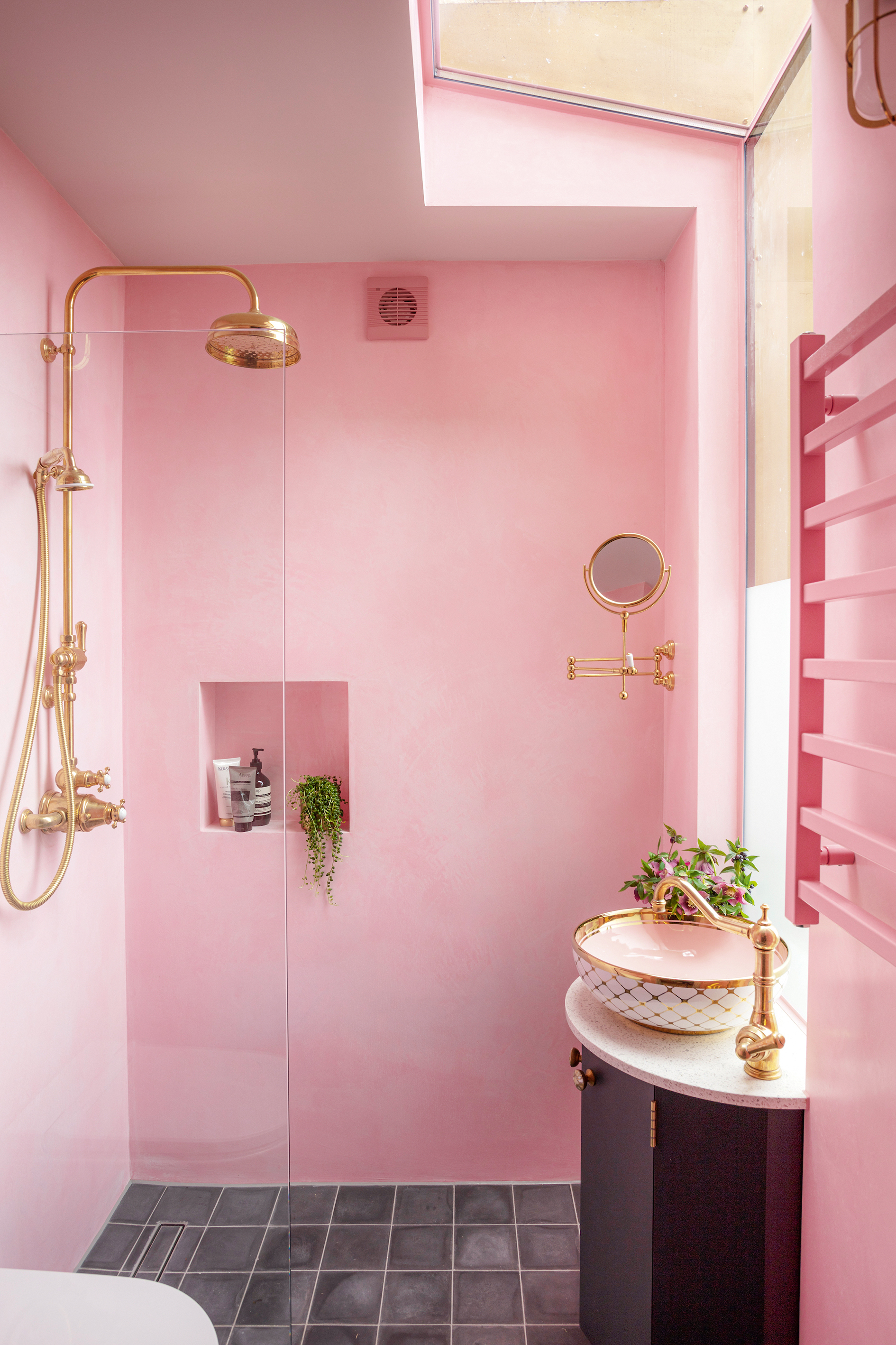 Pink and black bathroom with walk in shower