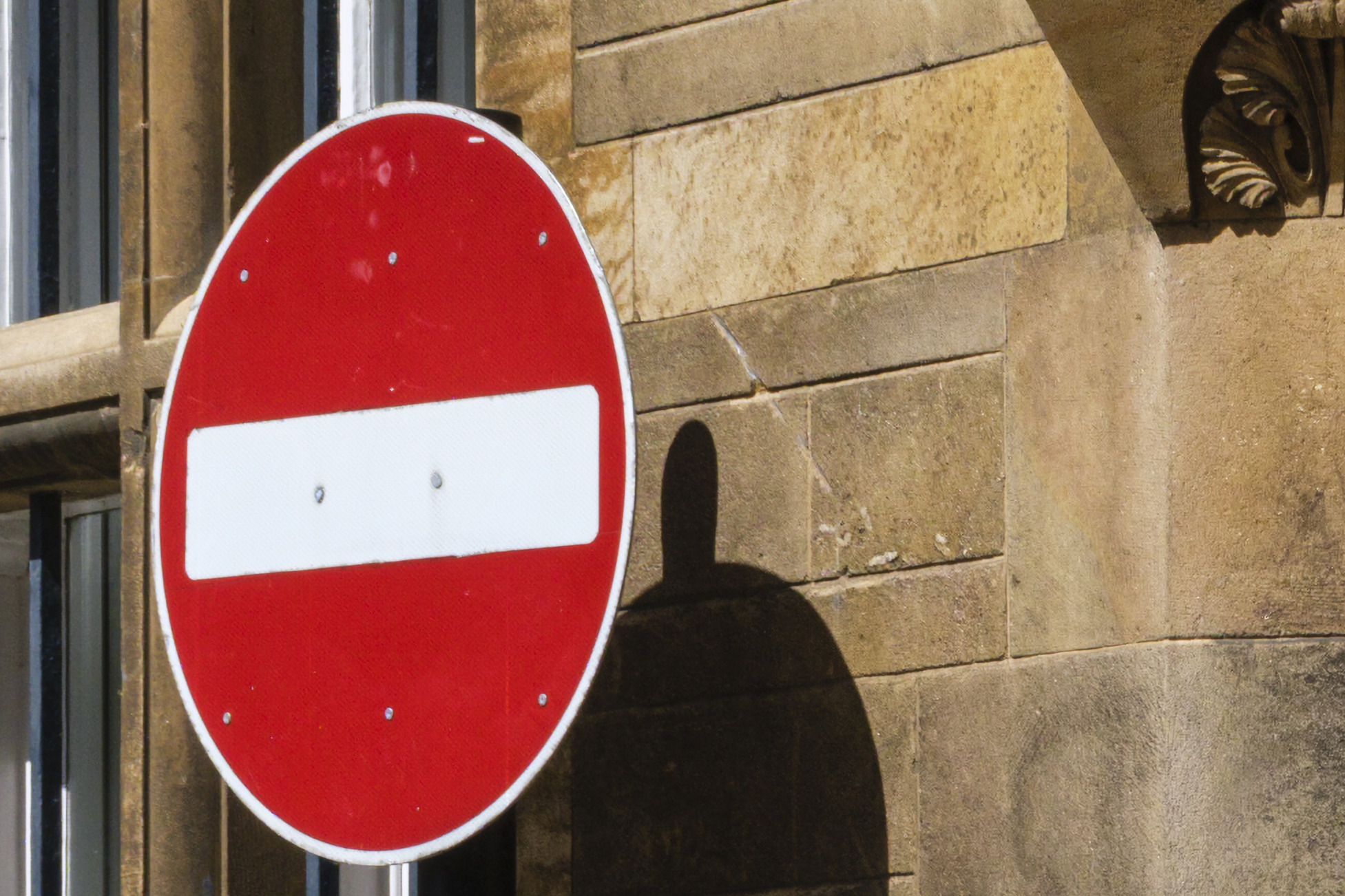 A man walking around a street corner