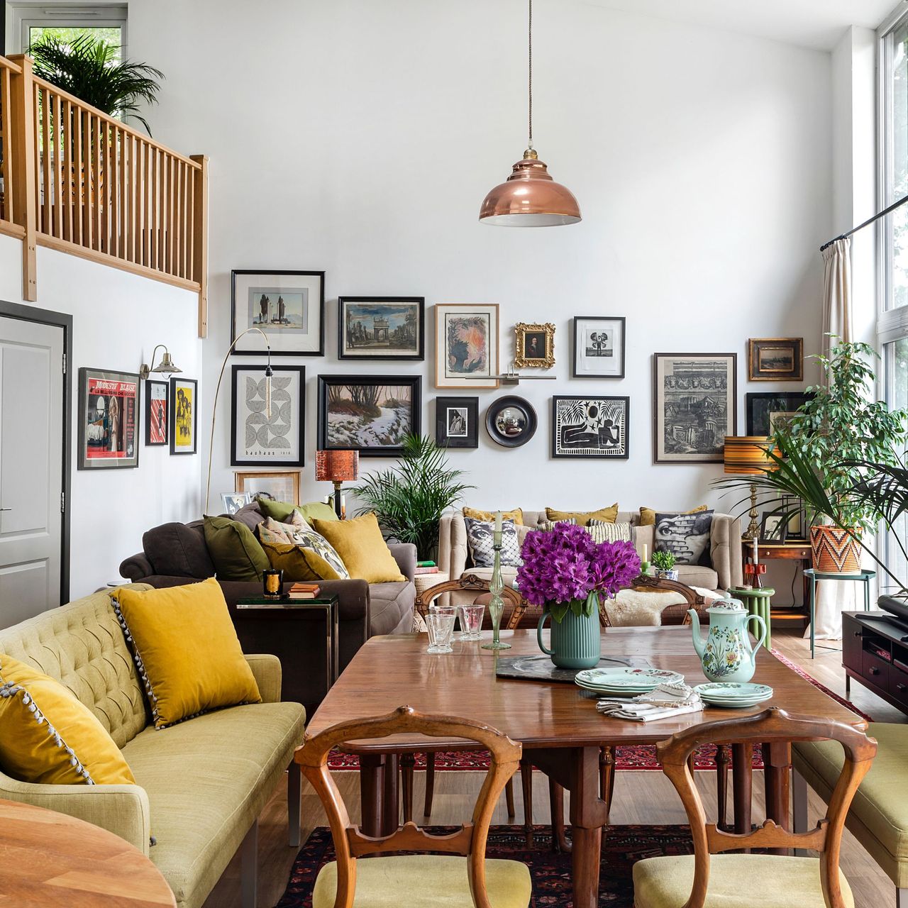 An eclectic mix of furniture and art transformed this bland white barn conversion into a home bursting with character