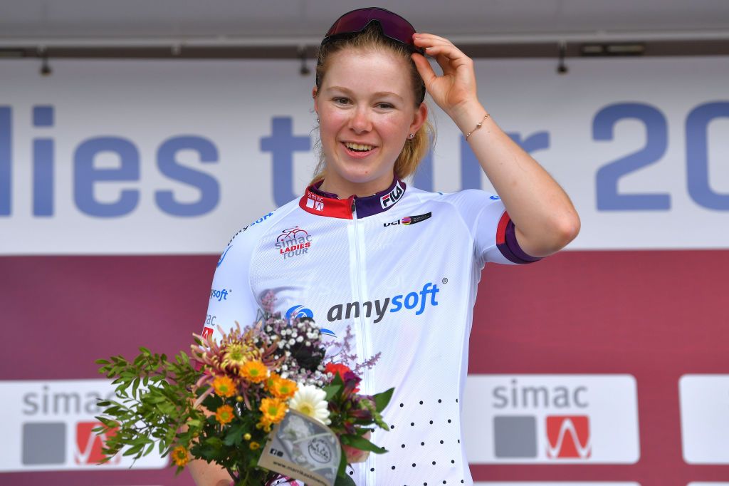 EDE NETHERLANDS AUGUST 24 Lonneke Uneken of Netherlands and Team SD Worx celebrates winning the White Best Young Rider Jersey on the podium ceremony after the 23rd Simac Ladies Tour 2021 Prologue a 24km Individual Time Trial stage from Ede to Ede SLT2021 SimacDS UCIWWT on August 24 2021 in Ede Netherlands Photo by Luc ClaessenGetty Images