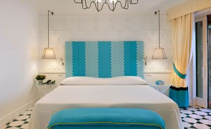 Blue and white bed sheets of suite