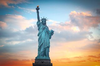 Photo of the Statue of Liberty at sunrise