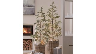 Scandi -style living room with snowy Alpine fir artificial Christmas tree