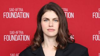 Alexandra Daddario stares straight at the camera in a black belted look at SAG-AFTRA Foundation Conversations Presents "Couples Weekend."