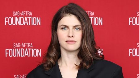Alexandra Daddario stares straight at the camera in a black belted look at SAG-AFTRA Foundation Conversations Presents "Couples Weekend." 