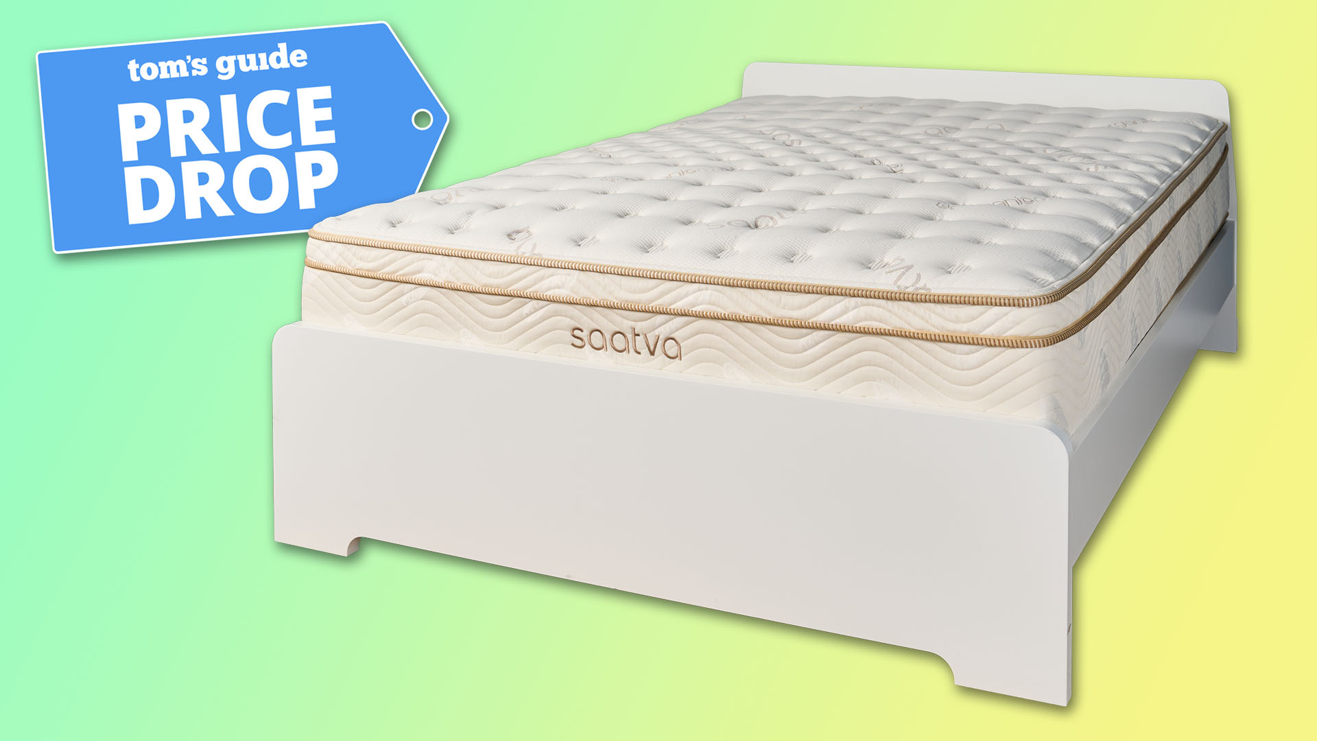 The Saatva Classic mattress on a white bedframe against a green and yellow background, a Tom's Guide Price Drop deals badge in the top left corner