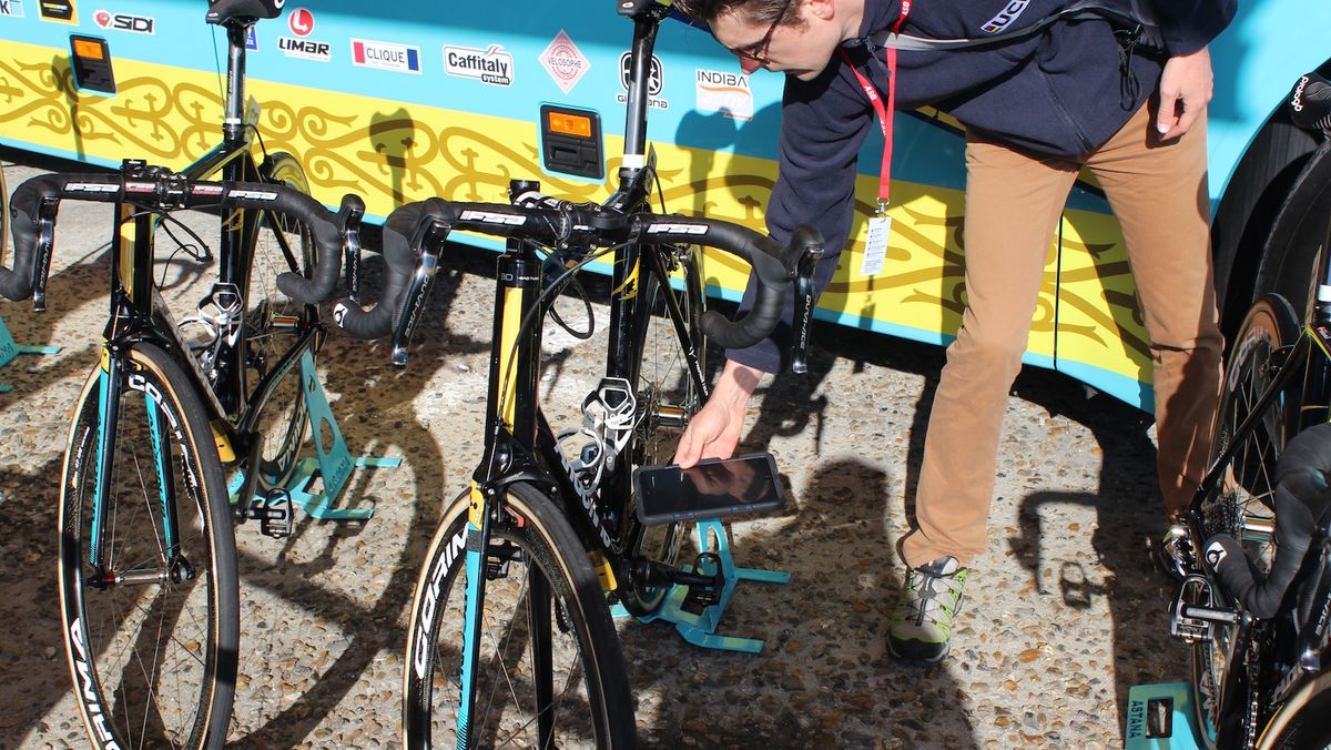 A UCI representative checks and Astana bike for 'Mechanical Fraud'