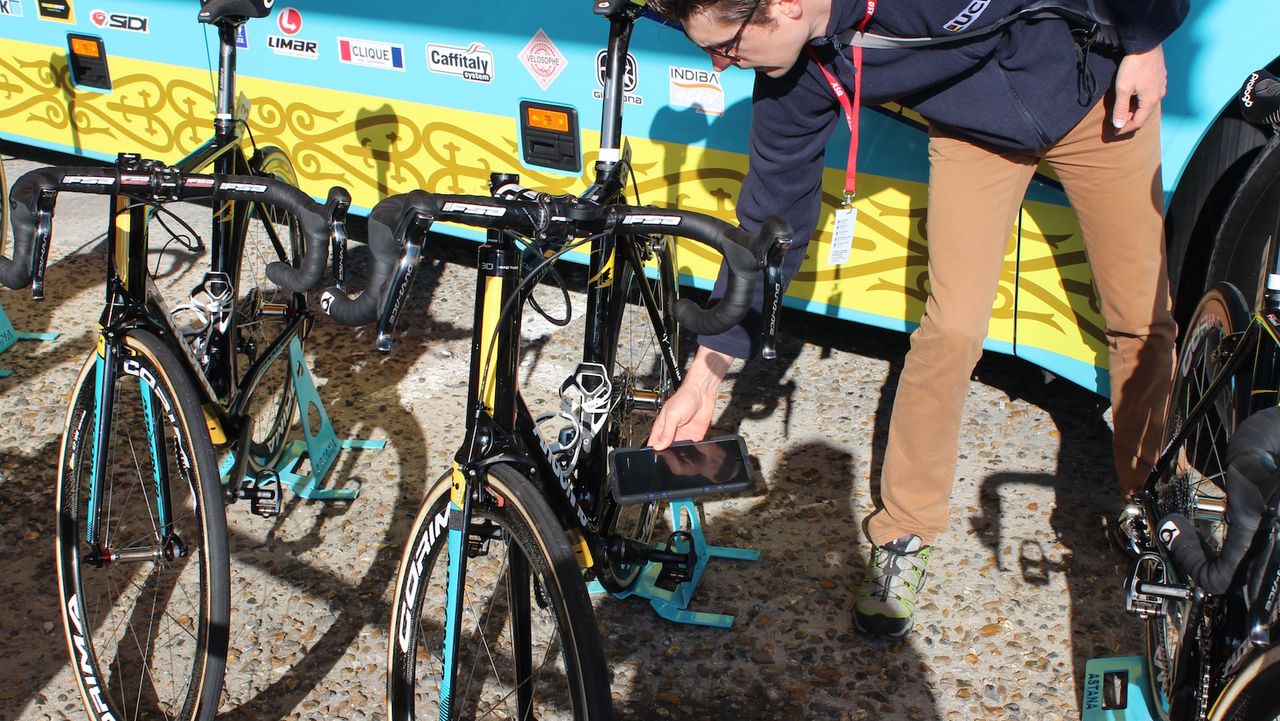 A UCI representative checks and Astana bike for 'Mechanical Fraud'