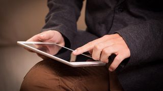 A person using an iPad.