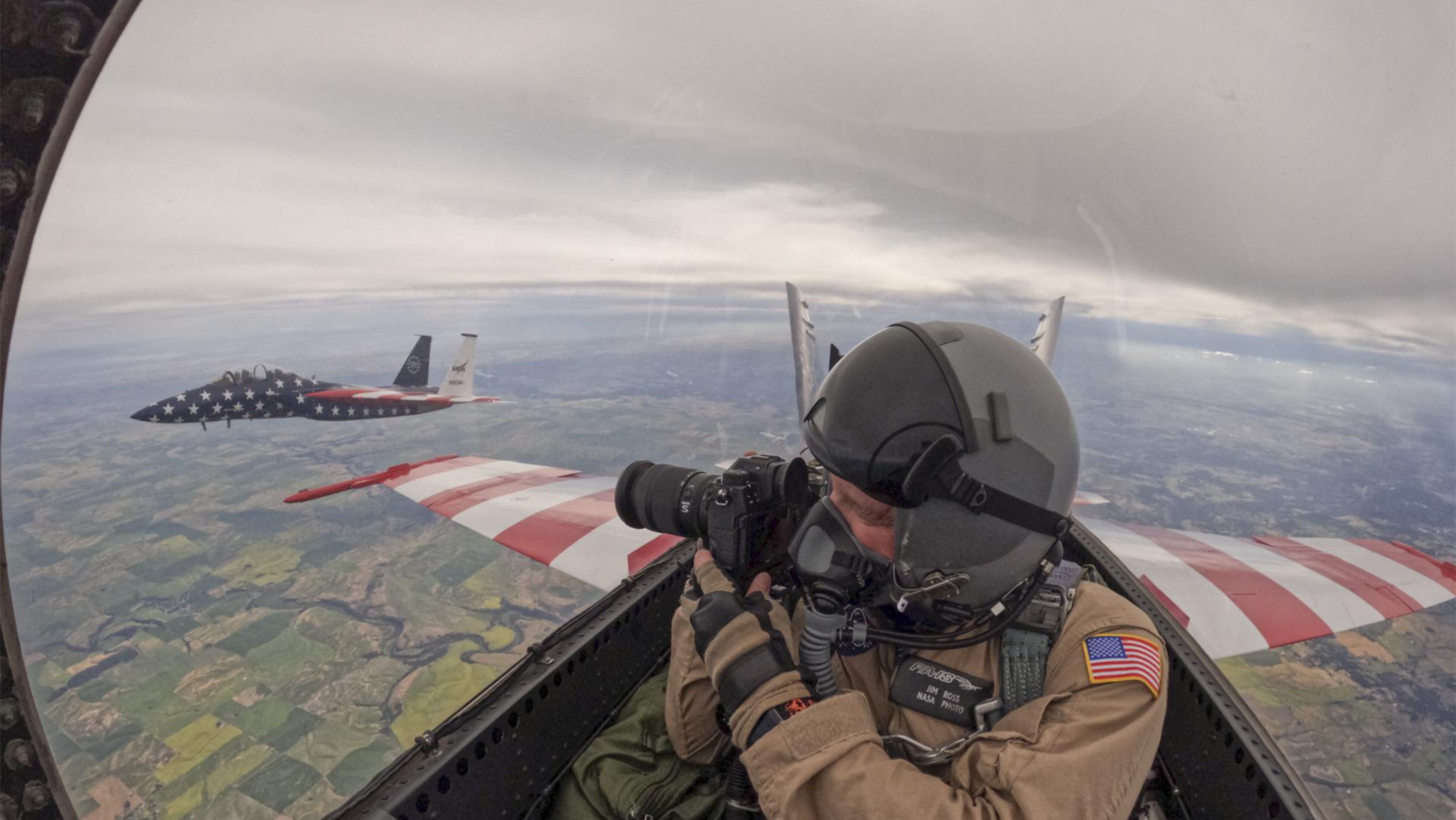 Photographer takes aerial picture of F-15 fighter jet flying over Washington, D.C are from backseat of F-18 fighter jet aircraft.