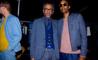 Male models wearing the Oliver Spencer S/S 2015 collection. On the left the model is wearing a denim outfit with a mustard shirt. The two models next to each other is wearing different outfits from the same blue textile.