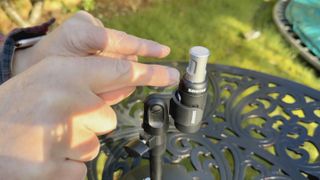 Shot of the Shure MoveMic 88+ mounted vertically on its supplied 5/8” mic clip to record an interview