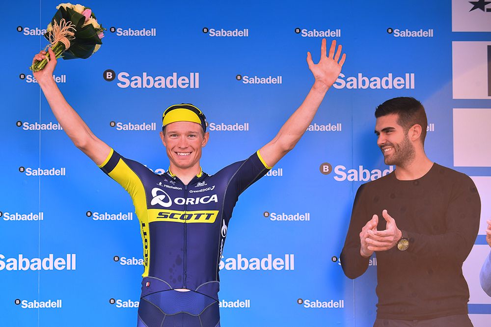 Magnus Cort Nielsen celebrates on the podium after winning stage 3 in Valencia