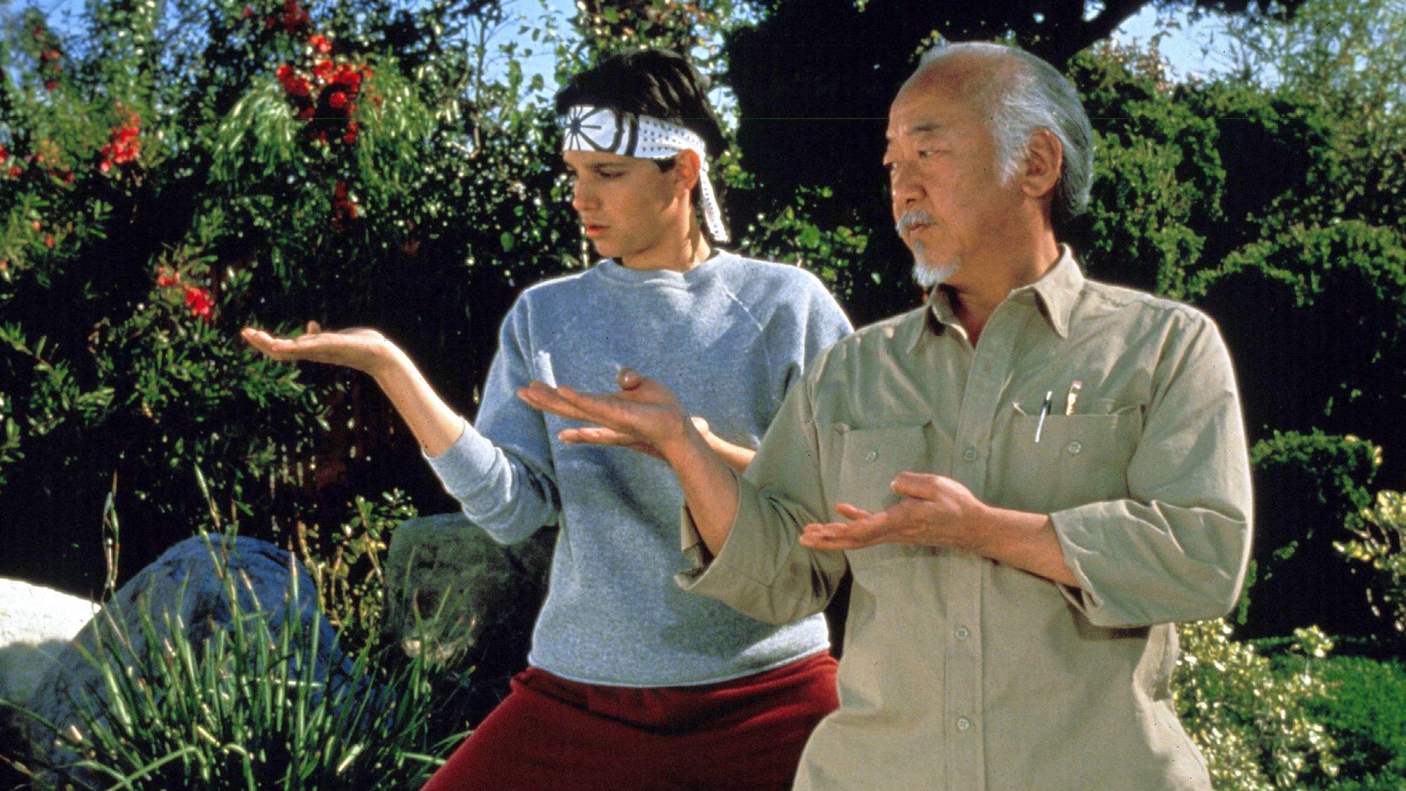 (L-R) Ralph Macchio as Daniel LaRusso and Pat Morita as Mr. Miyagi in "The Karate Kid"