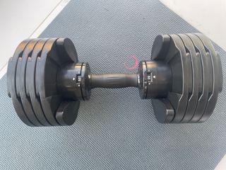 Core Home Fitness adjustable dumbbells on an exercise mat