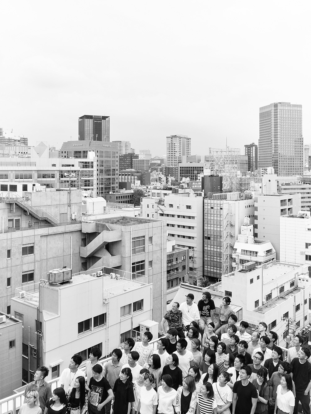 A photo of TeamLab stood on a balcony