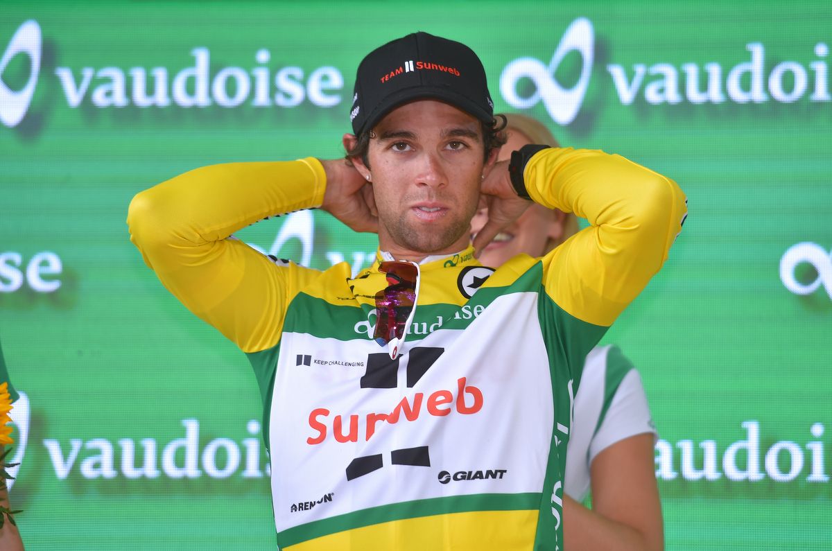 New race leader Michael Matthews adjusts the jersey