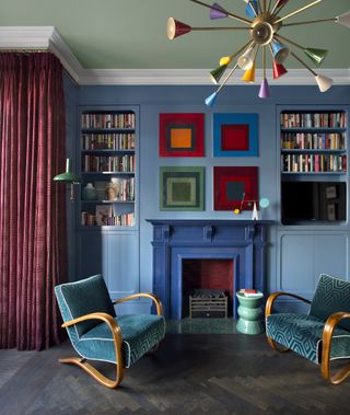 A royal blue fireplace and light blue wall
