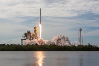 A SpaceX Falcon 9 rocket launches a pre-flown Dragon cargo capsule from NASA’s Kennedy Space Center on June 3, 2017.